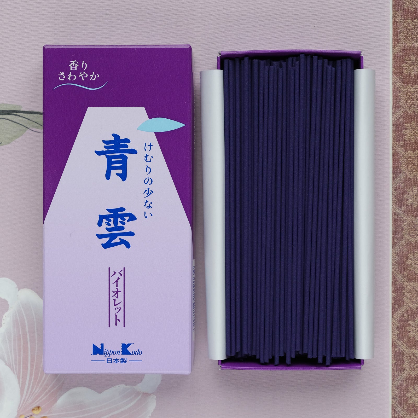 The Seiun Violet Incense comes in a purple box and emits a calming violet fragrance. Upon opening, youll find neatly arranged dark purple sticks ideal for meditation and relaxation. The packaging features Japanese text and illustrations for an authentic touch.