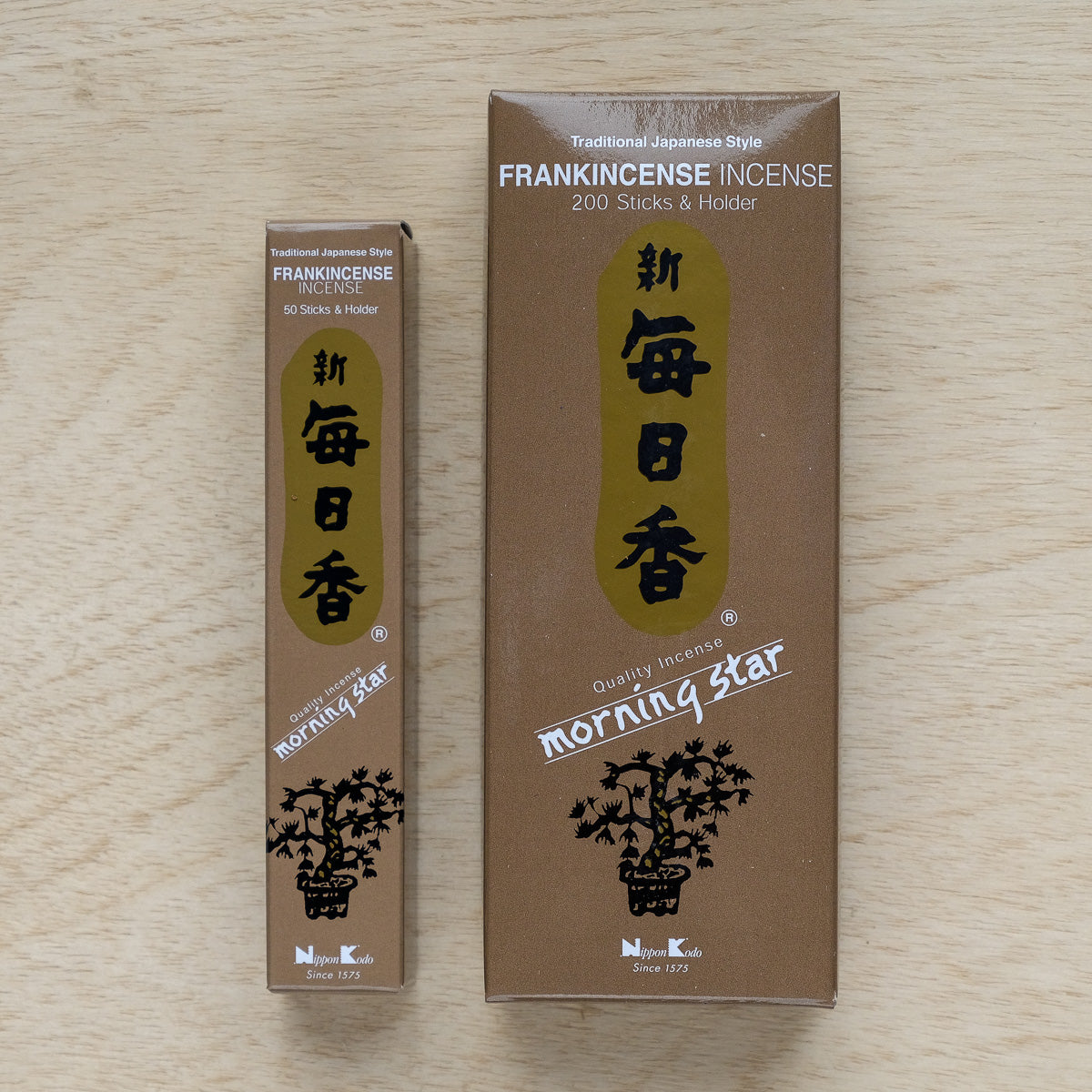 Two boxes of Morning Star Frankincense Incense showcase traditional Japanese style. The smaller box contains 50 sticks and the larger 200, both adorned with gold and white Japanese characters on a brown background, reflecting classic Japanese incense design.