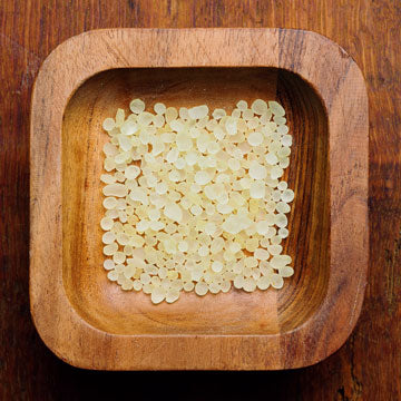 Mastic incense in a wooden bowl.