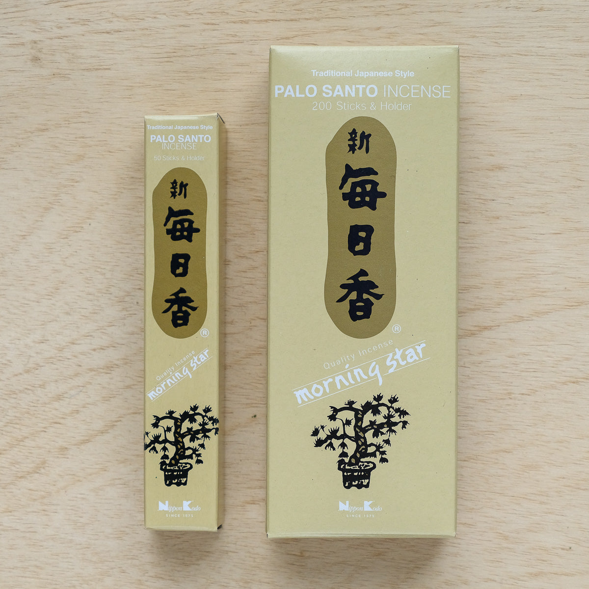 Two boxes of Morning Star Palo Santo Incense with subtle frankincense scent: one larger box contains 200 sticks and a holder. Both feature black Japanese characters and tree graphics on a beige background.