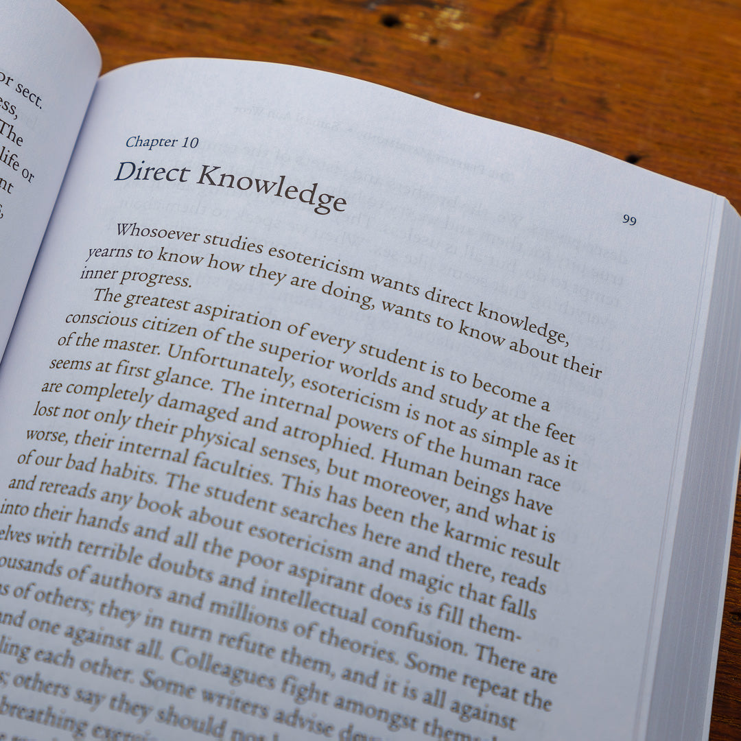 An open book titled Perfect Matrimony lies on a wooden table, displaying Chapter 10 about esoteric knowledge and its effect on human life, hinting at forbidden insights. The text is in black font on white paper, with deep shadows playing across the page.