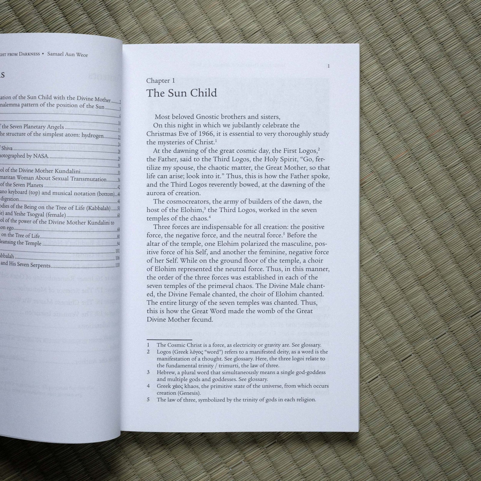 Open book with text on a textured surface