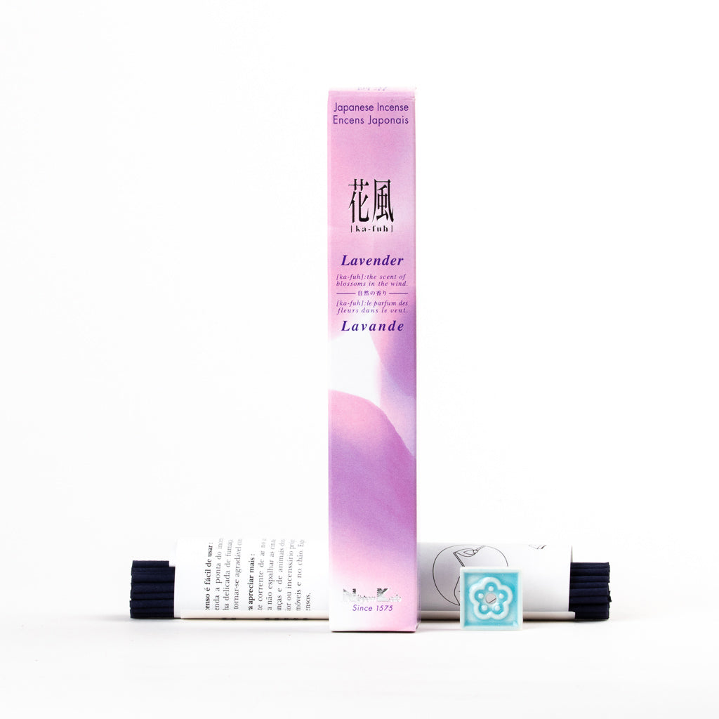 The Ka-Fuh Lavender Incense is featured in purple and white packaging, displayed upright. In front are black incense sticks and a square teal holder with a floral pattern, ensuring a pure lavender fragrance essence.