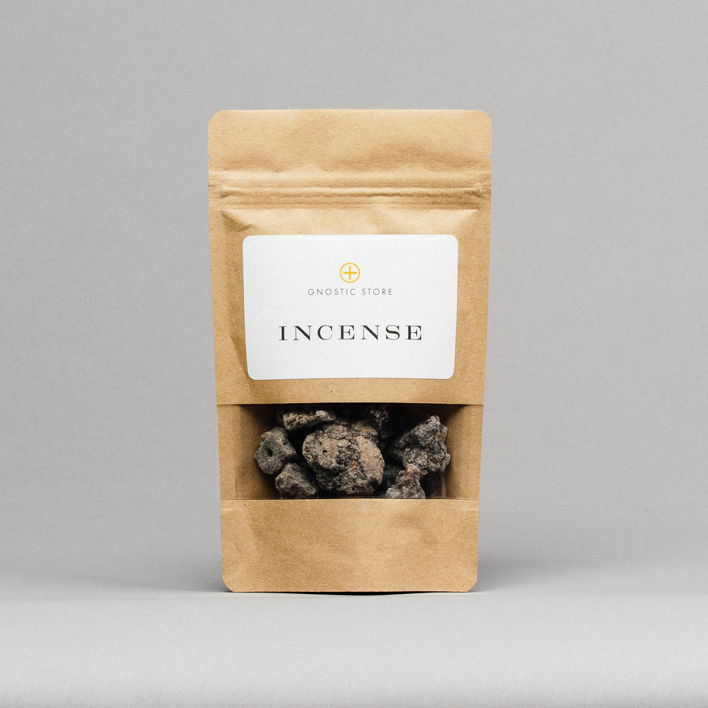 A brown paper pouch labeled Gnostic Store features Frankincense Resin Incense: First Grade Black (Boswellia neglecta from Ethiopia) prominently. Inside are irregularly shaped dark resin pieces against a plain gray background.