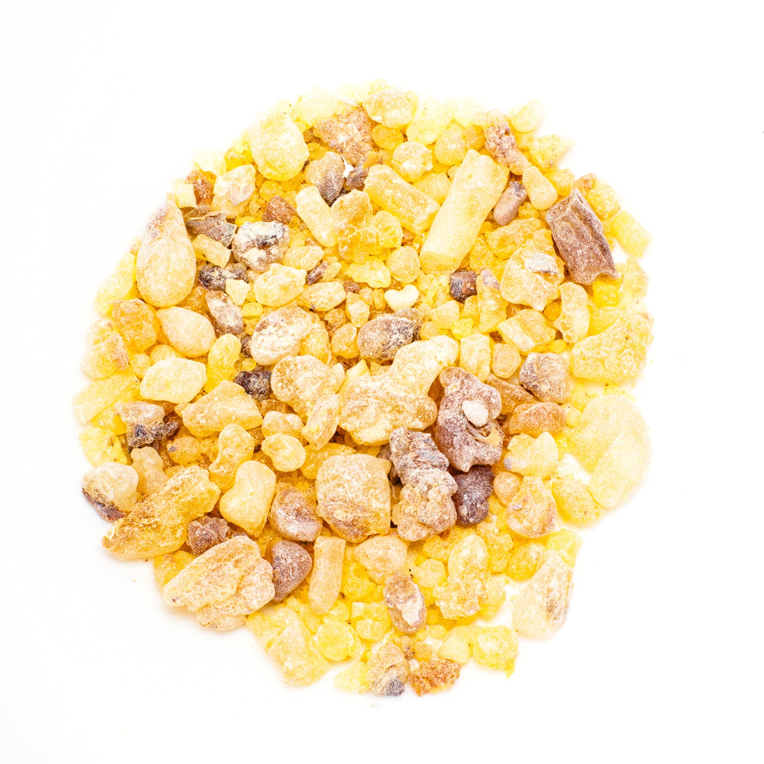 The Frankincense Resin Incense, Common Grade features a mound of yellow and brown crystals from Boswellia trees on a white background, showcasing varied textures and opacities, with some pieces being more translucent than others.
