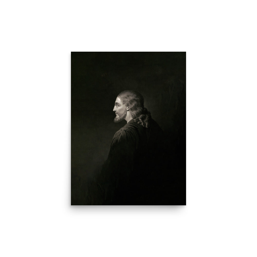 The Authentic Image of Jesus Museum-grade Print features a black and white portrait of a long-haired person in profile, donned in a dark robe. The shadowy background enhances their contemplative expression, evoking the image of Jesus of Nazareth.